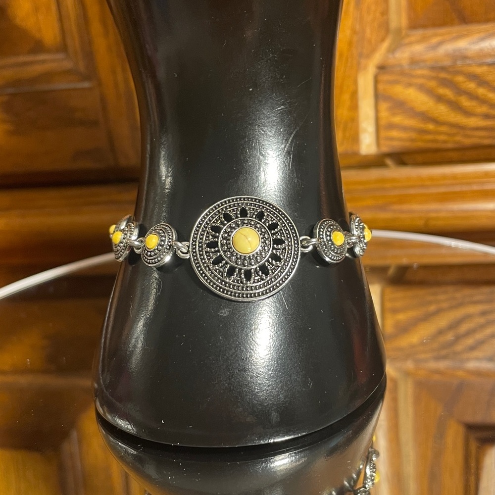 Bracelet w/ Intricate Silver setting of connecting medallions and a yellow bead